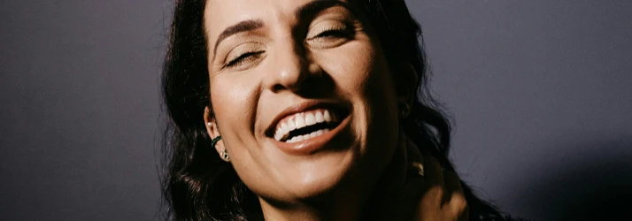 close up of a beautiful woman smiling wide