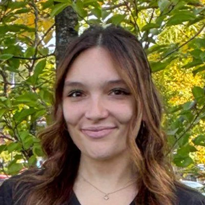 A headshot photo of Justine, a patient care coordinator