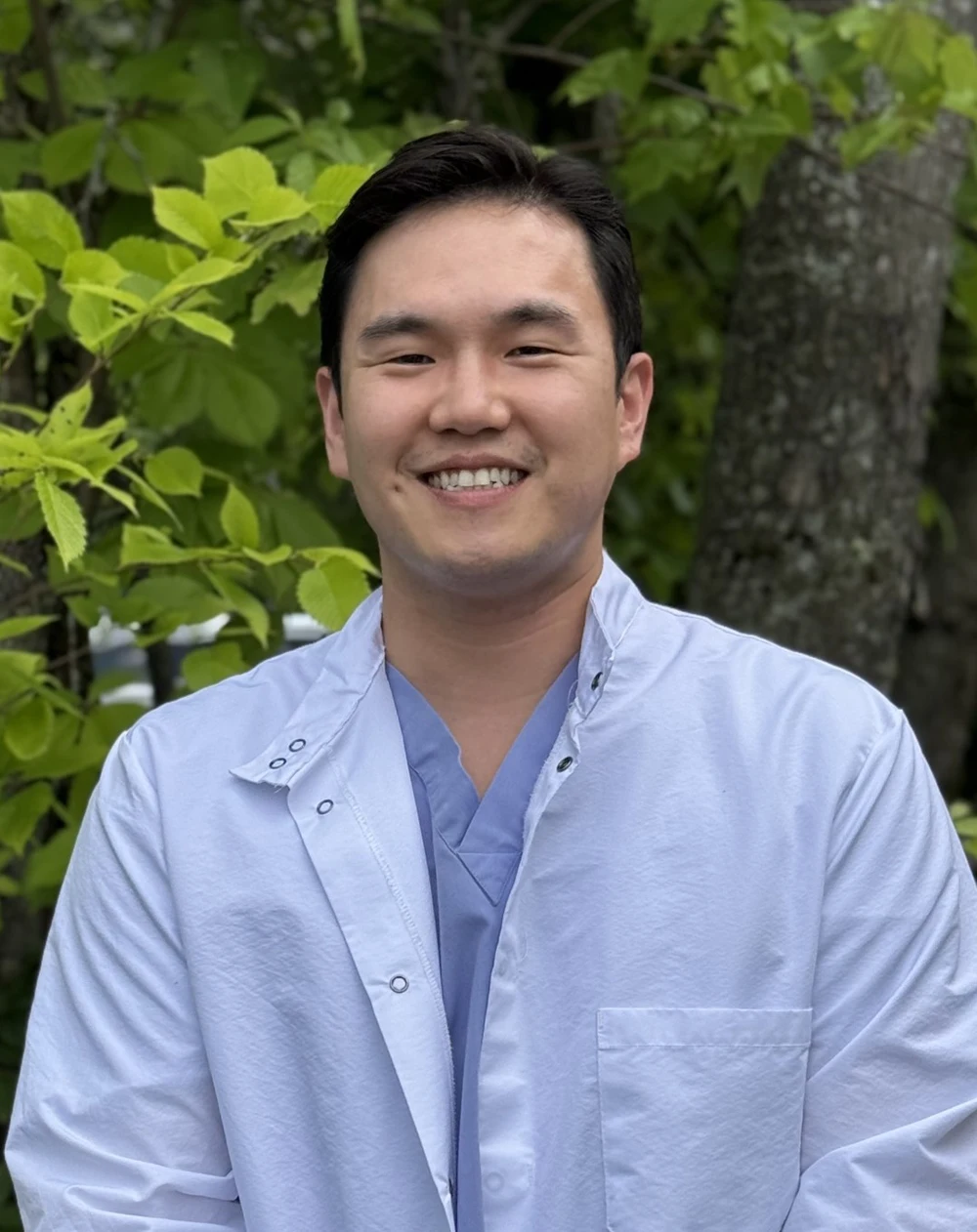 Dentist Augusta ME Ryan Lee is Outside Smiling at the Viewer for the Main Header Ryan Lee is Outside Smiling at the Viewer for the Main Header